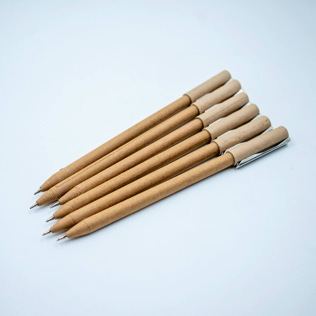Plastic-free ball pen with recycled paper barrel and durable metal clip. Smooth everyday writing, eco-friendly choice. Available in multipacks.
